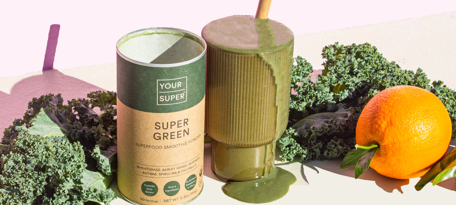 Super Green smoothie, orange, and greens layout